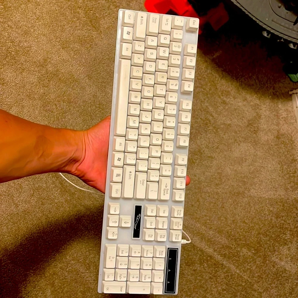 This is my keyboard it has a light up button and it turns to multiple colors.